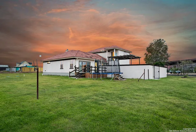 a view of a swimming pool with a lake from a balcony