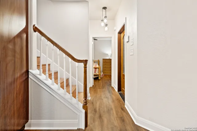 a view of an entryway with wooden floor