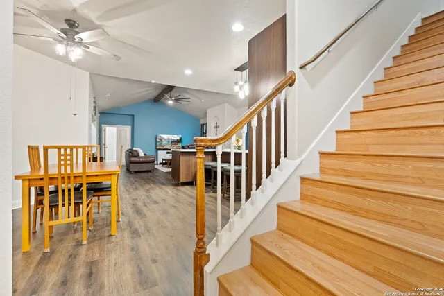 a view of a dining room with furniture and wooden floor