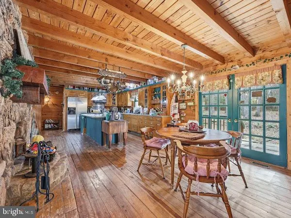 a view of a room with wooden floor