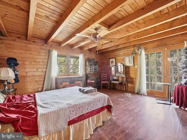 a view of front door with dining room and wooden floor