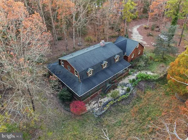 an aerial view of a house with outdoor space