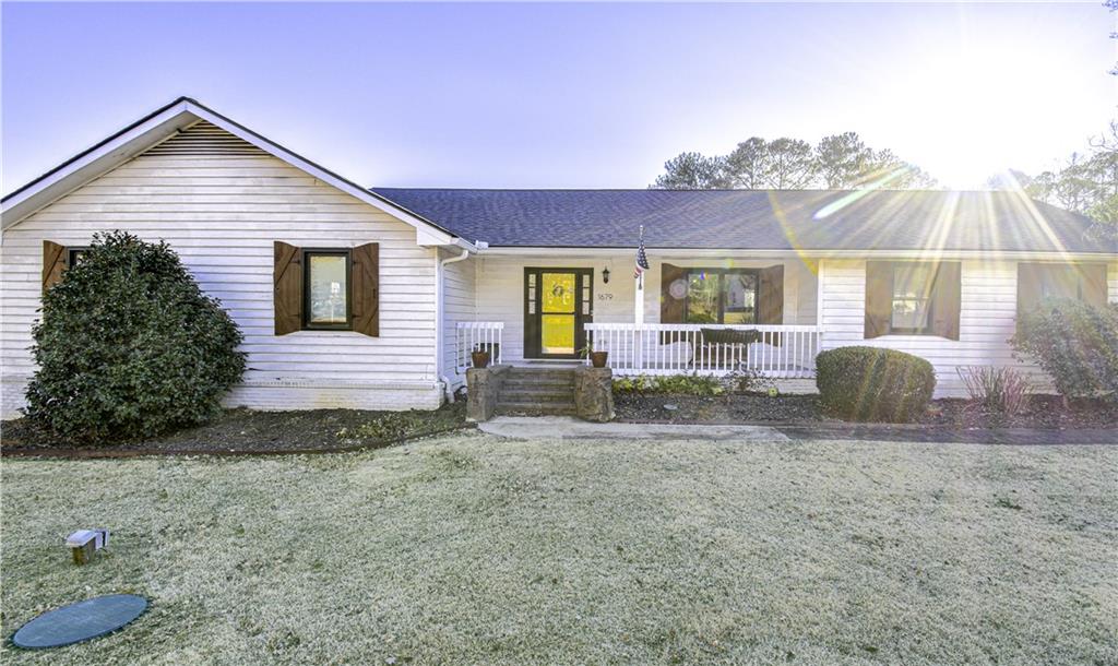 1679 Rangewood Drive Southwest Lilburn, GA 30047 - Photo 14 of 22 a view of backyard of house