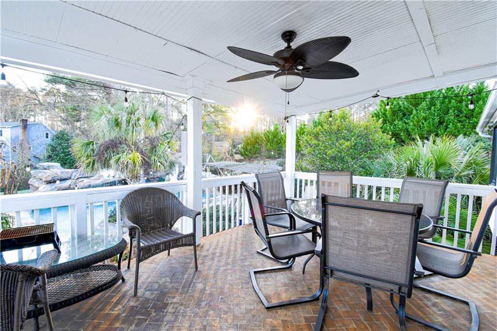 1679 Rangewood Drive Southwest Lilburn, GA 30047 - Photo 16 of 22 a view of a porch with furniture and a yard