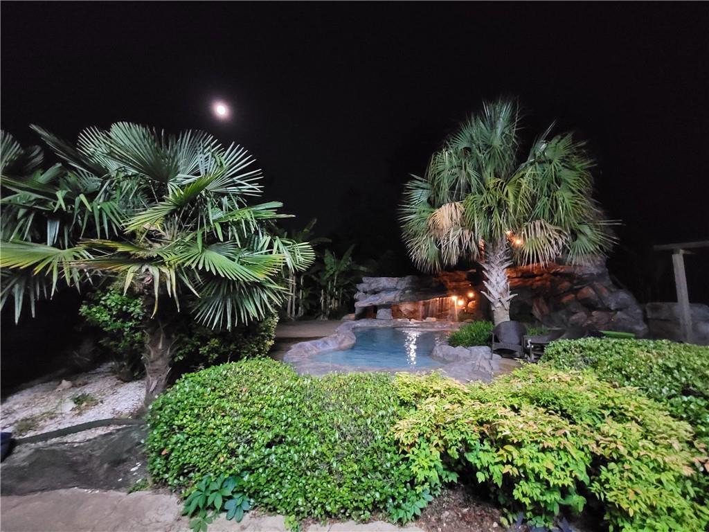 1679 Rangewood Drive Southwest Lilburn, GA 30047 - Photo 17 of 22 a house with lots of green space