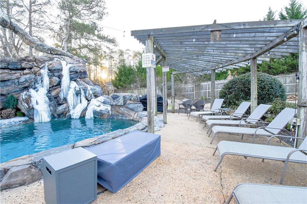 1679 Rangewood Drive Southwest Lilburn, GA 30047 - Photo 20 of 22 a view of patio with swimming pool