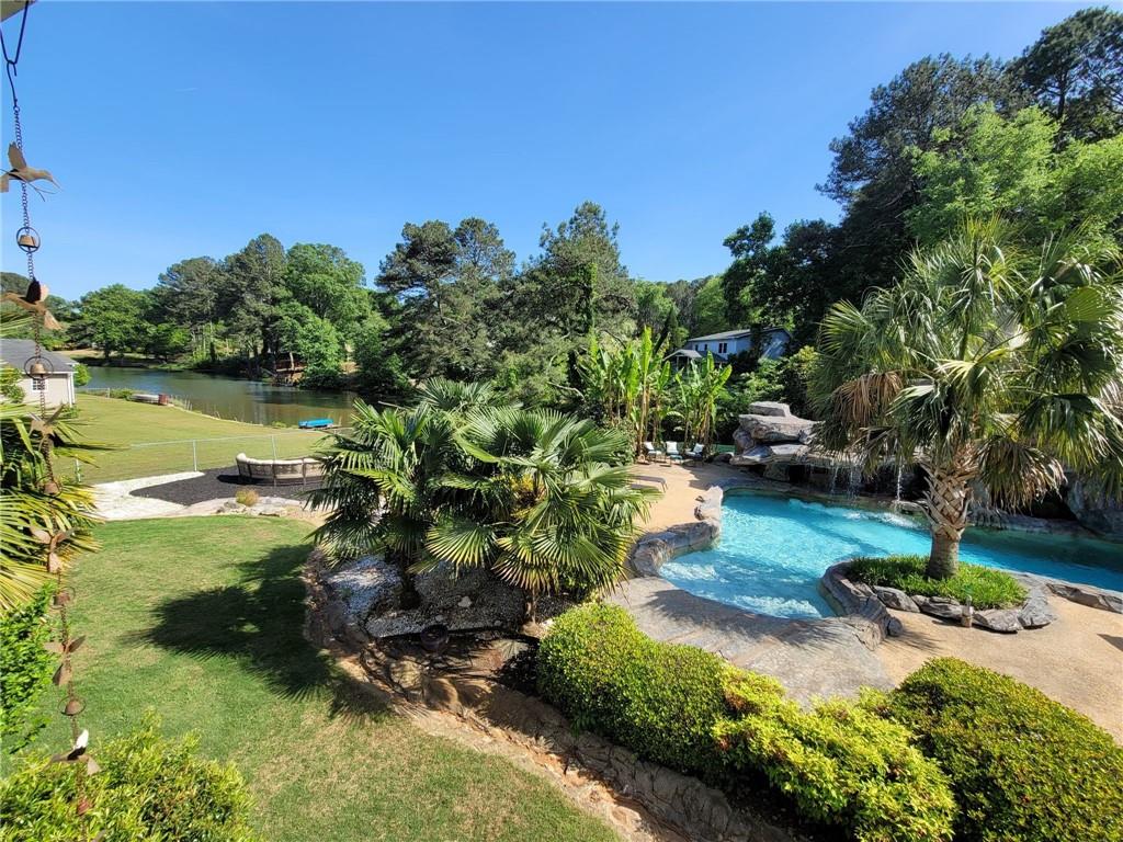1679 Rangewood Drive Southwest Lilburn, GA 30047 - Photo 2 of 22 a view of a park with large trees