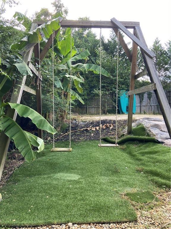 1679 Rangewood Drive Southwest Lilburn, GA 30047 - Photo 6 of 22 a view of a chair and table in the garden