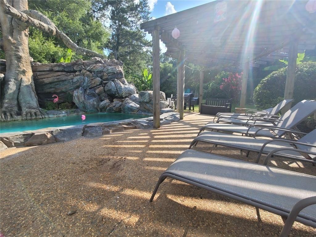 1679 Rangewood Drive Southwest Lilburn, GA 30047 - Photo 10 of 22 a view of backyard with trampoline