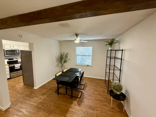 a workspace with furniture and a window