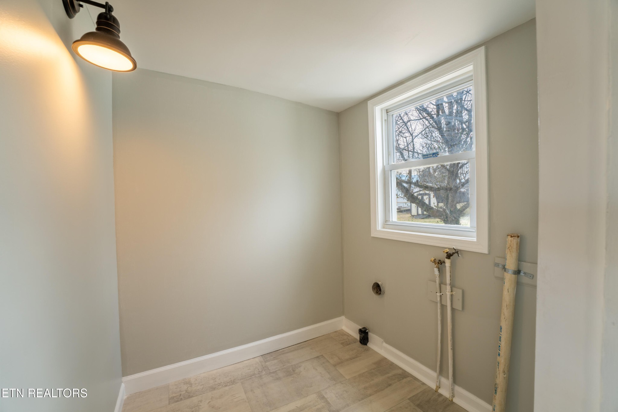 7909 Warwick Lane Corryton, TN 37721 - Photo 15 of 33 a view of a bathroom with wooden floor and a window