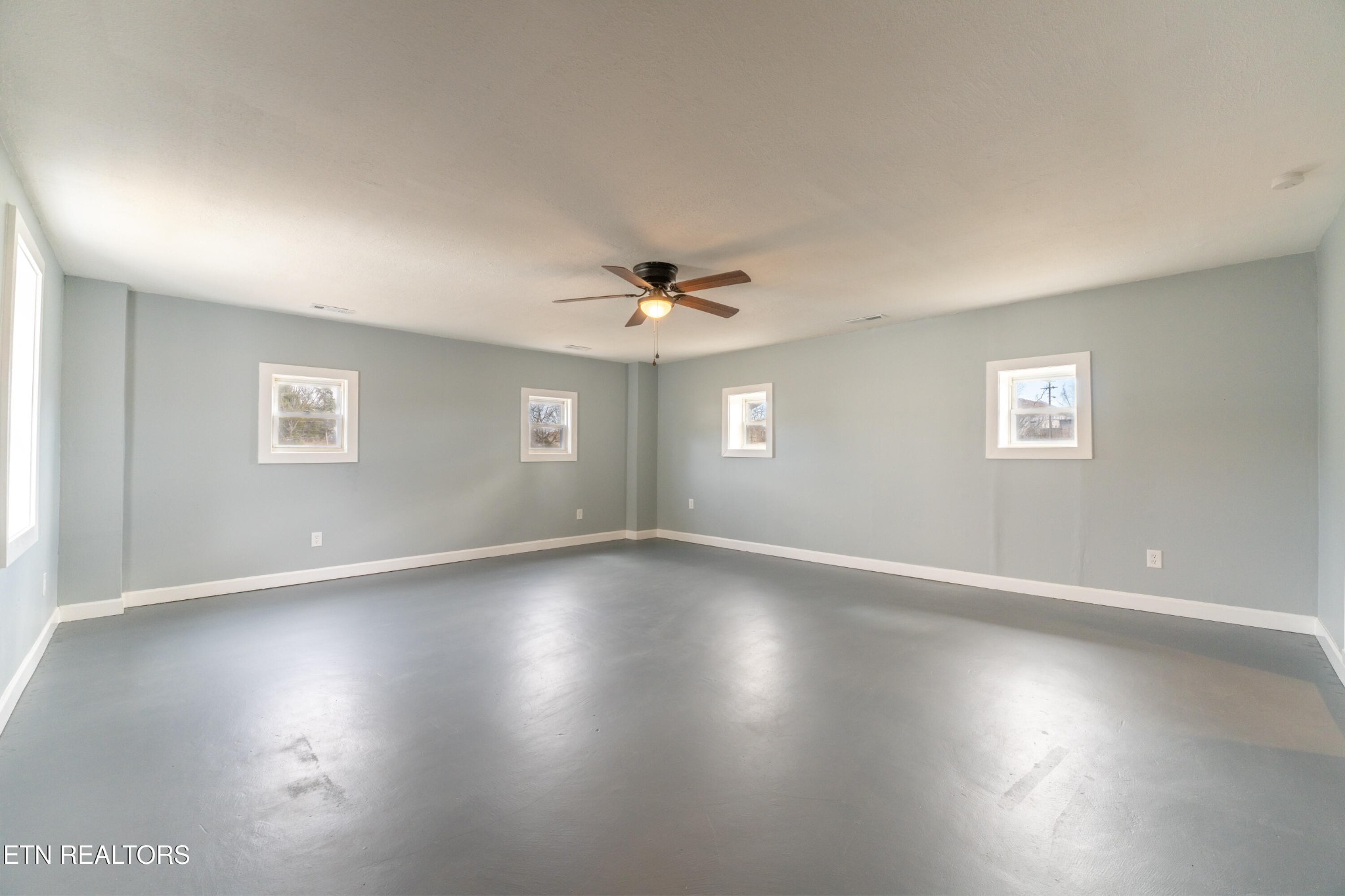 7909 Warwick Lane Corryton, TN 37721 - Photo 17 of 33 a view of an empty room with wooden floor and a window
