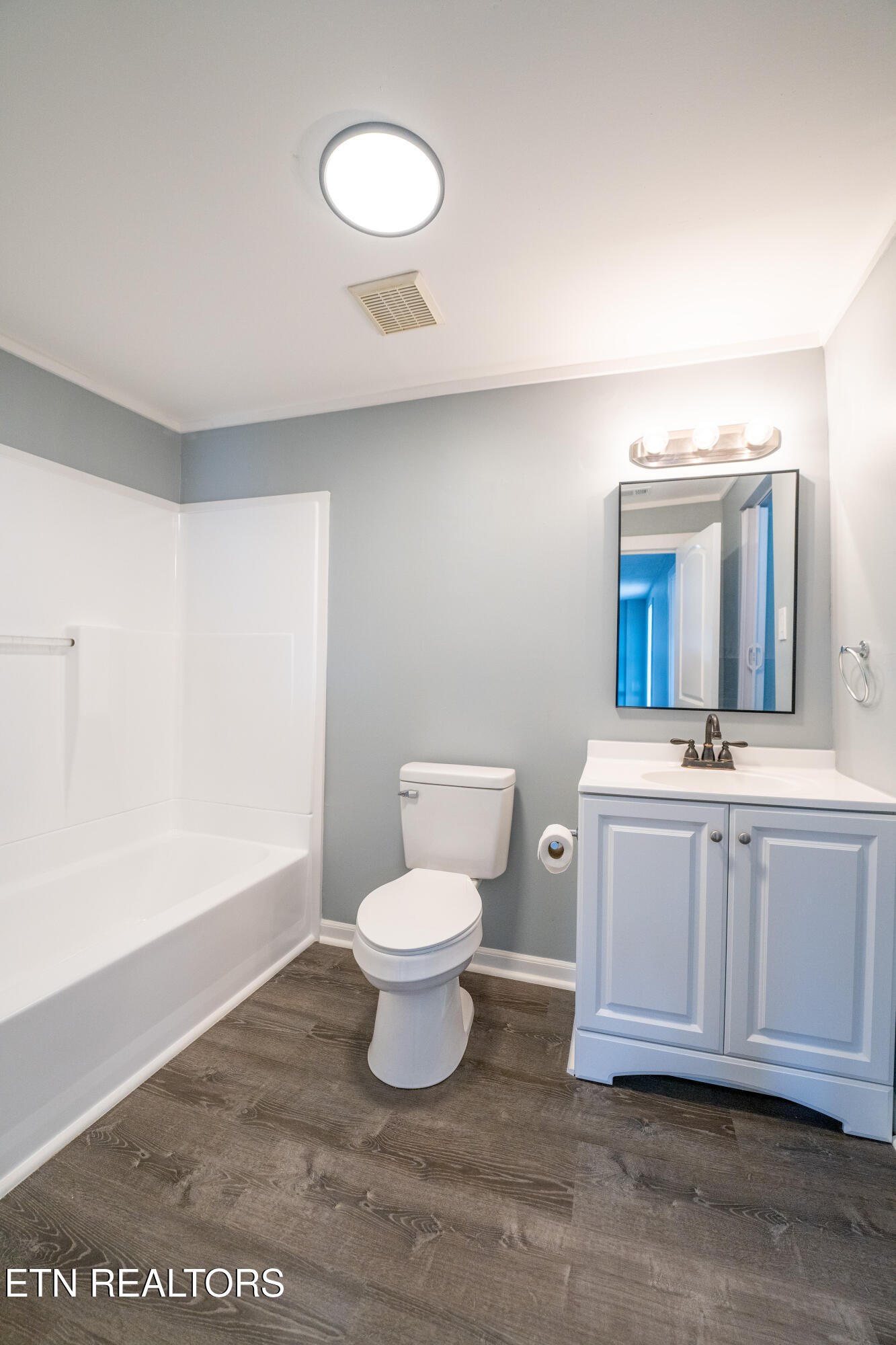 7909 Warwick Lane Corryton, TN 37721 - Photo 22 of 33 a bathroom with a sink a toilet and a mirror