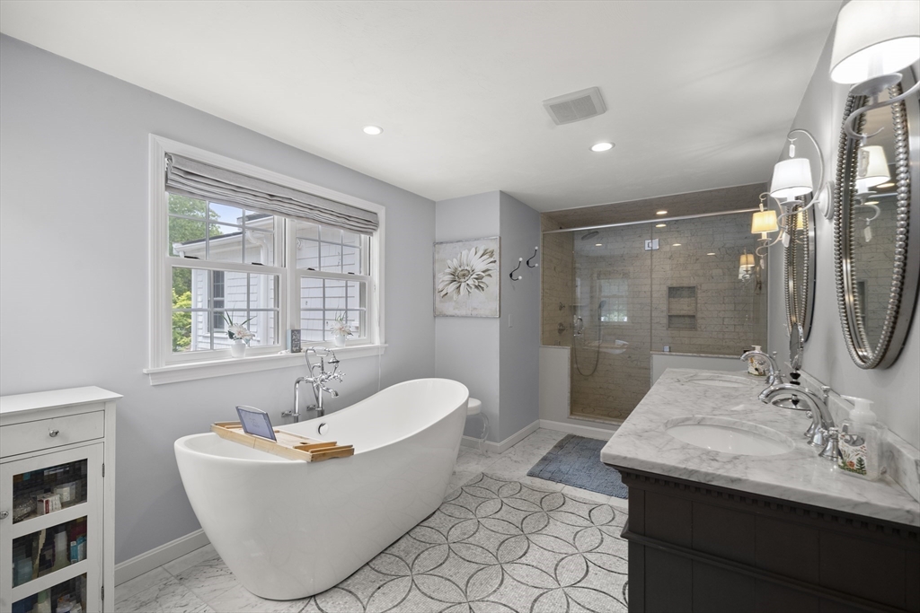 30 Franklin Rodgers Road Hingham, MA 02043 - Photo 26 of 37 a bath room with a mirror and a bath tub