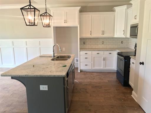 40 Cedar Grove Road Lebanon, TN 37087 - Photo 6 of 16 a kitchen with a sink a stove and cabinets