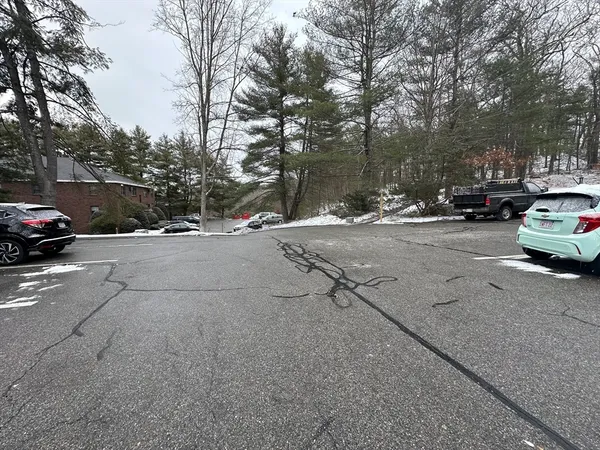 a view of street with parked cars
