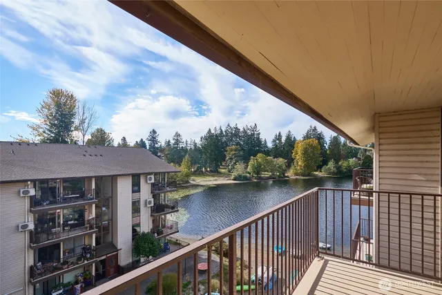 an aerial view of a house with swimming pool and outdoor space