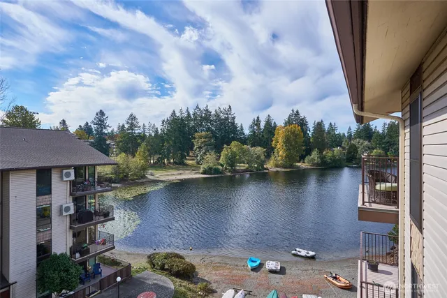 an aerial view of a house with swimming pool garden and balcony