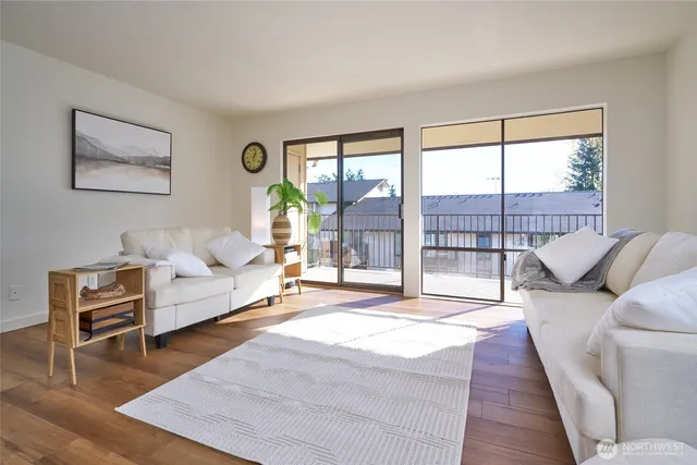 a living room with furniture and a large window