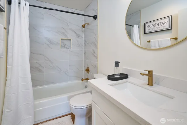 a bathroom with a shower a toilet and a shower