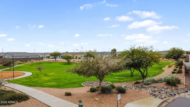 a view of a garden with a building in the background
