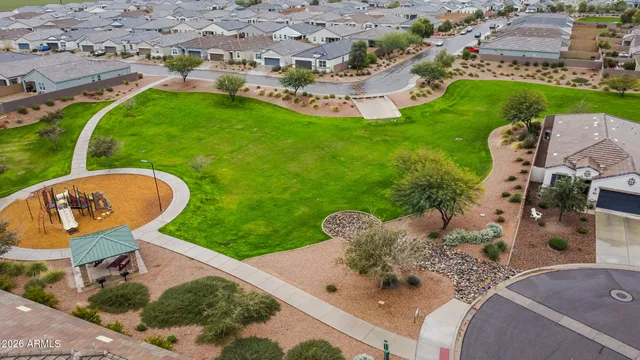 an aerial view of a house with garden space and outdoor seating