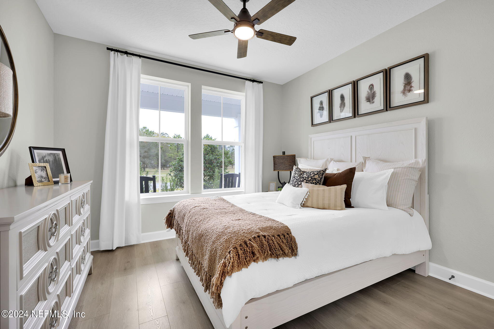 861 Goldenrod Drive St. Augustine, FL 32092 - Photo 14 of 83 a bedroom with a large bed and a window