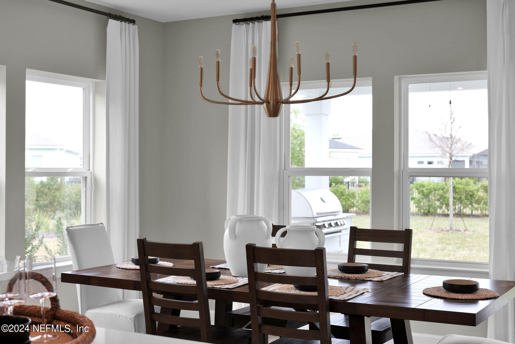 861 Goldenrod Drive St. Augustine, FL 32092 - Photo 20 of 83 a living room with furniture and large windows