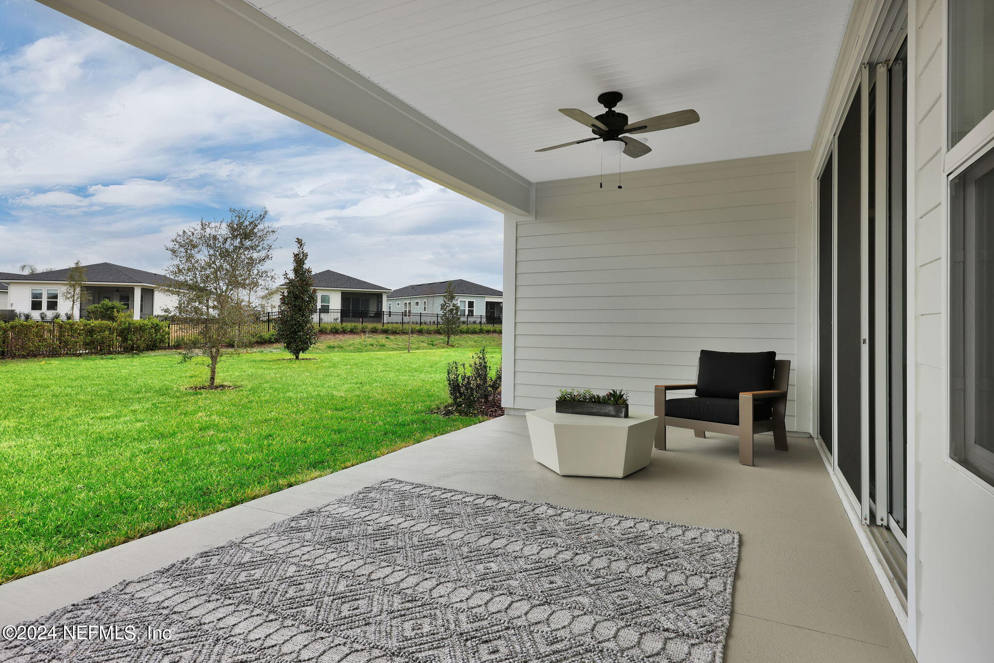 861 Goldenrod Drive St. Augustine, FL 32092 - Photo 2 of 83 a view of a patio with couches chairs and a yard