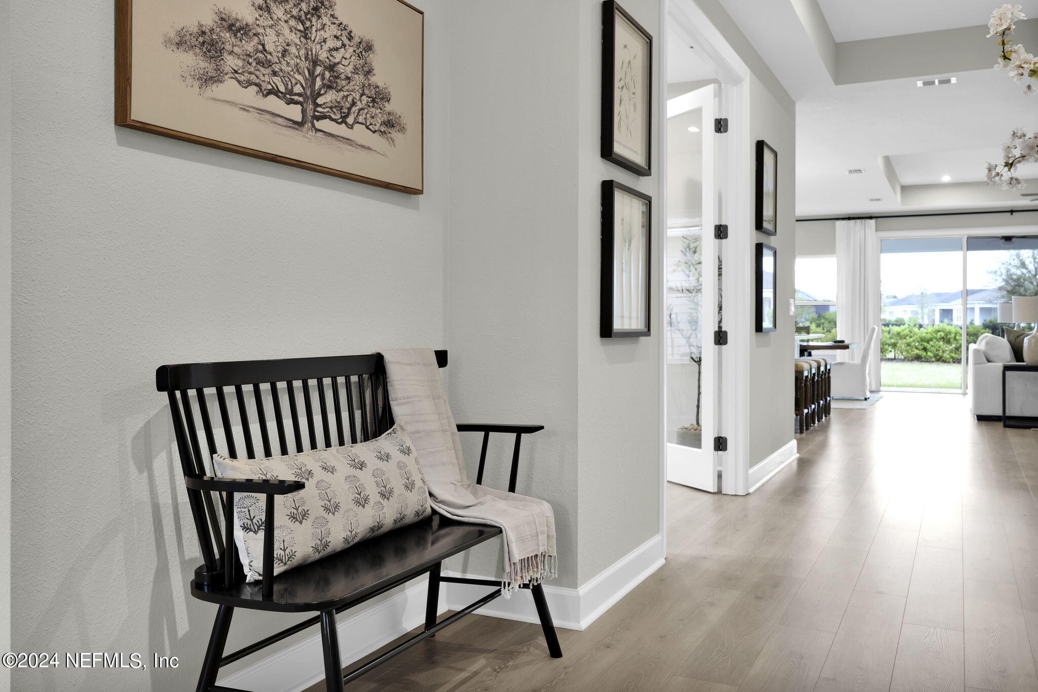 861 Goldenrod Drive St. Augustine, FL 32092 - Photo 27 of 83 a view of a hallway with wooden floor and a bathroom