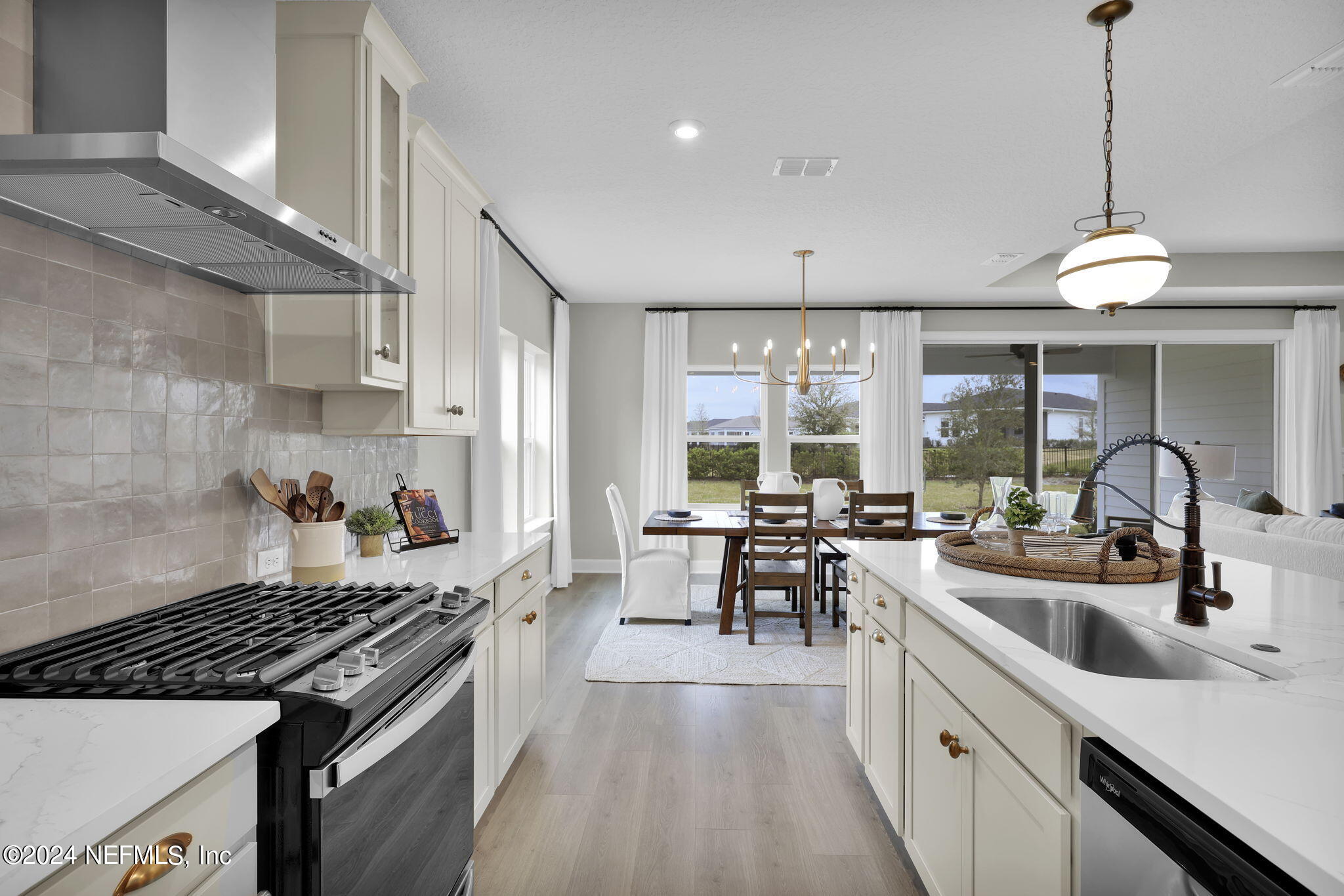 861 Goldenrod Drive St. Augustine, FL 32092 - Photo 44 of 83 a kitchen with lots of counter top space a sink appliances and cabinets