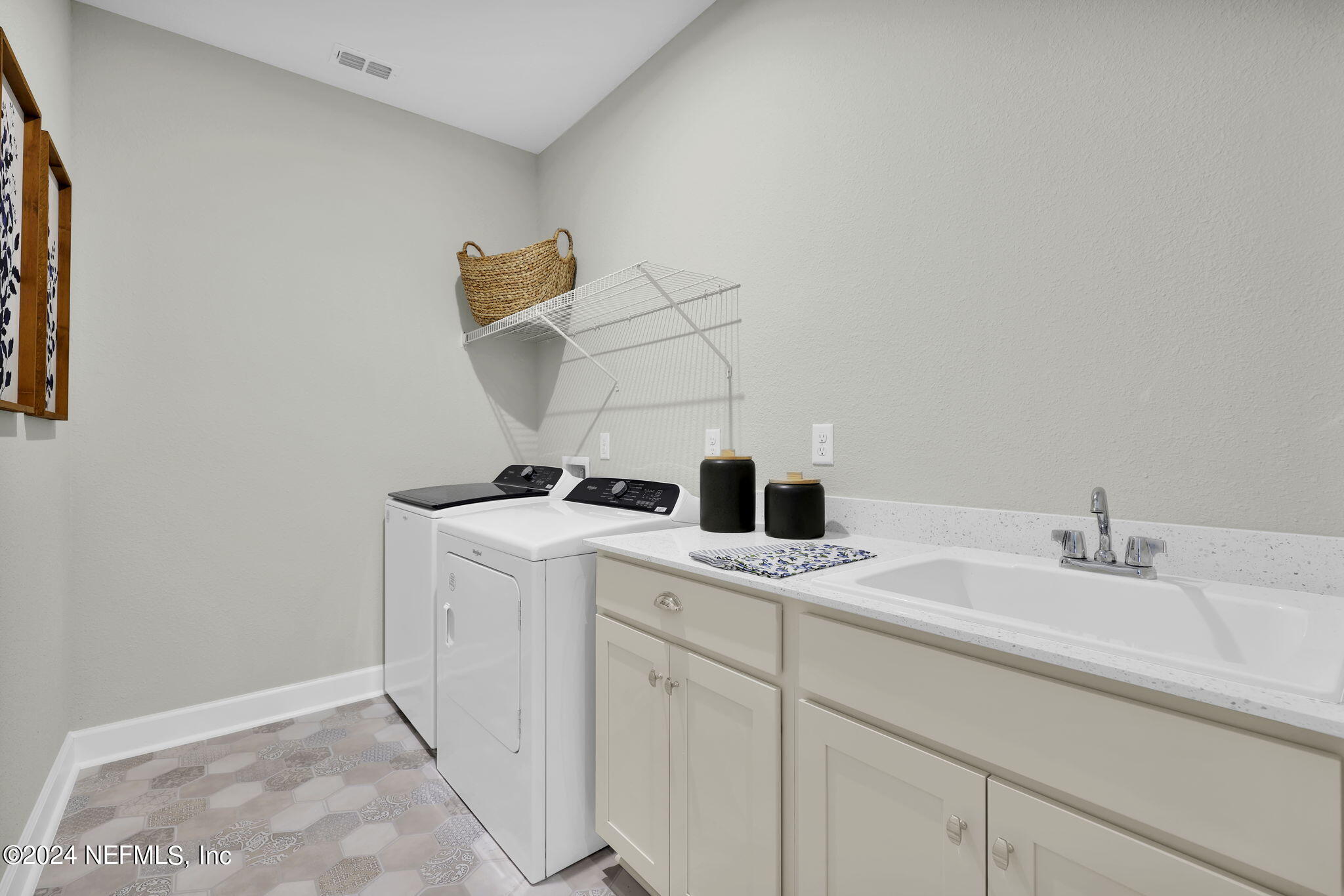 861 Goldenrod Drive St. Augustine, FL 32092 - Photo 46 of 83 a bathroom with a sink and a mirror