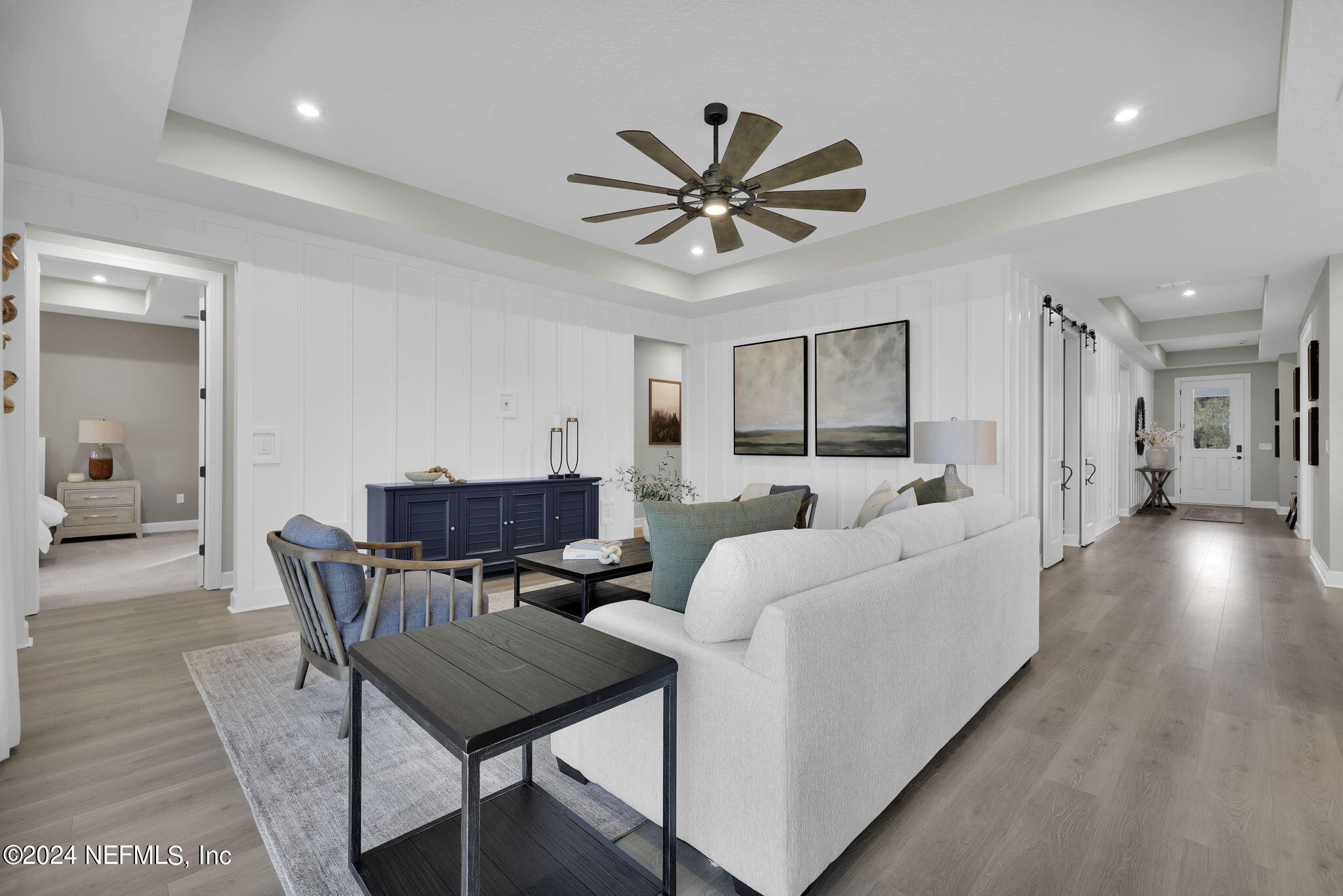 861 Goldenrod Drive St. Augustine, FL 32092 - Photo 48 of 83 a living room with furniture and a wooden floor