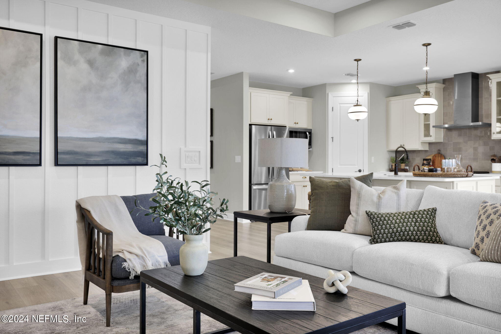 861 Goldenrod Drive St. Augustine, FL 32092 - Photo 54 of 83 a living room with furniture potted plant and a chandelier