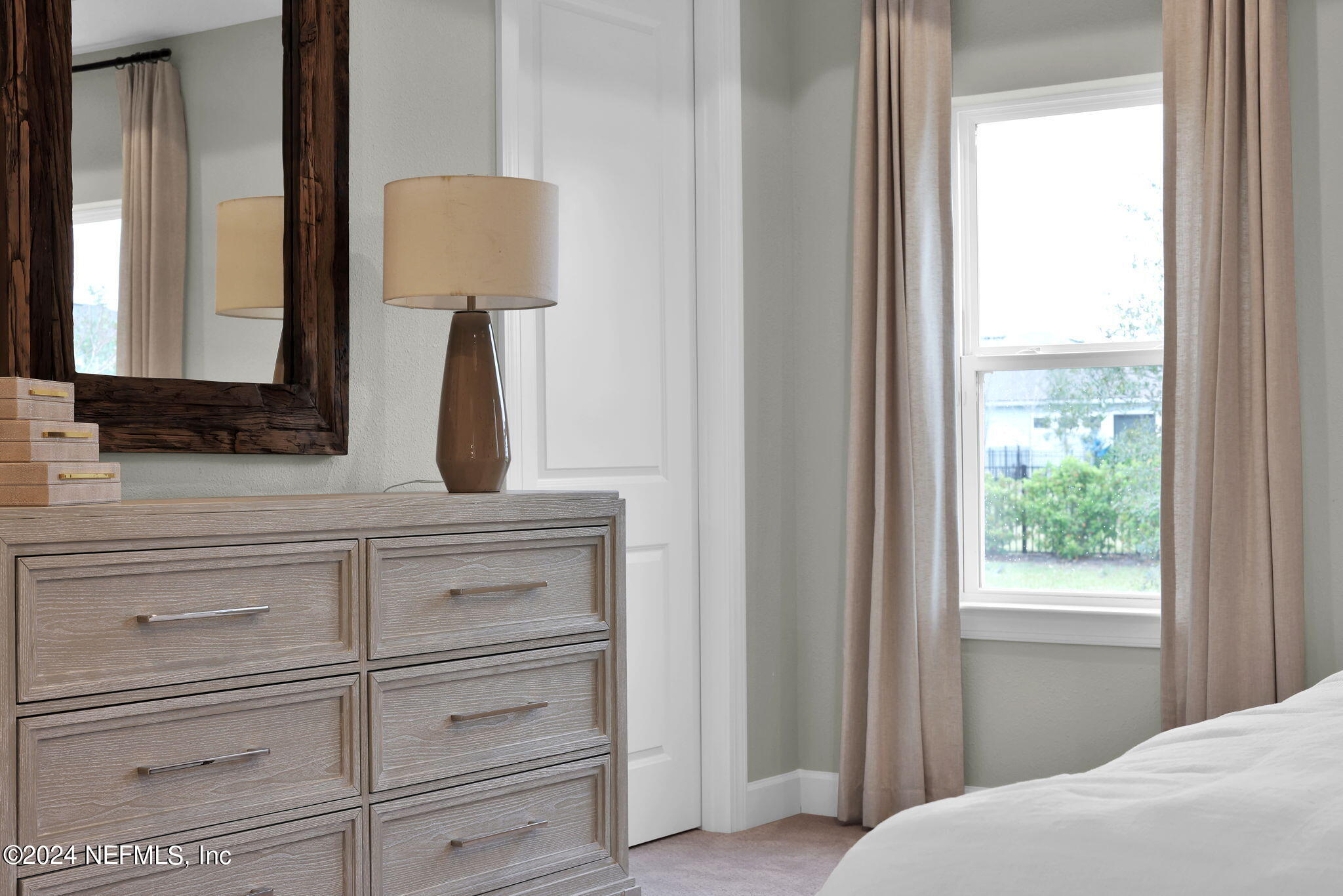 861 Goldenrod Drive St. Augustine, FL 32092 - Photo 67 of 83 a bathroom with a vanity and a mirror