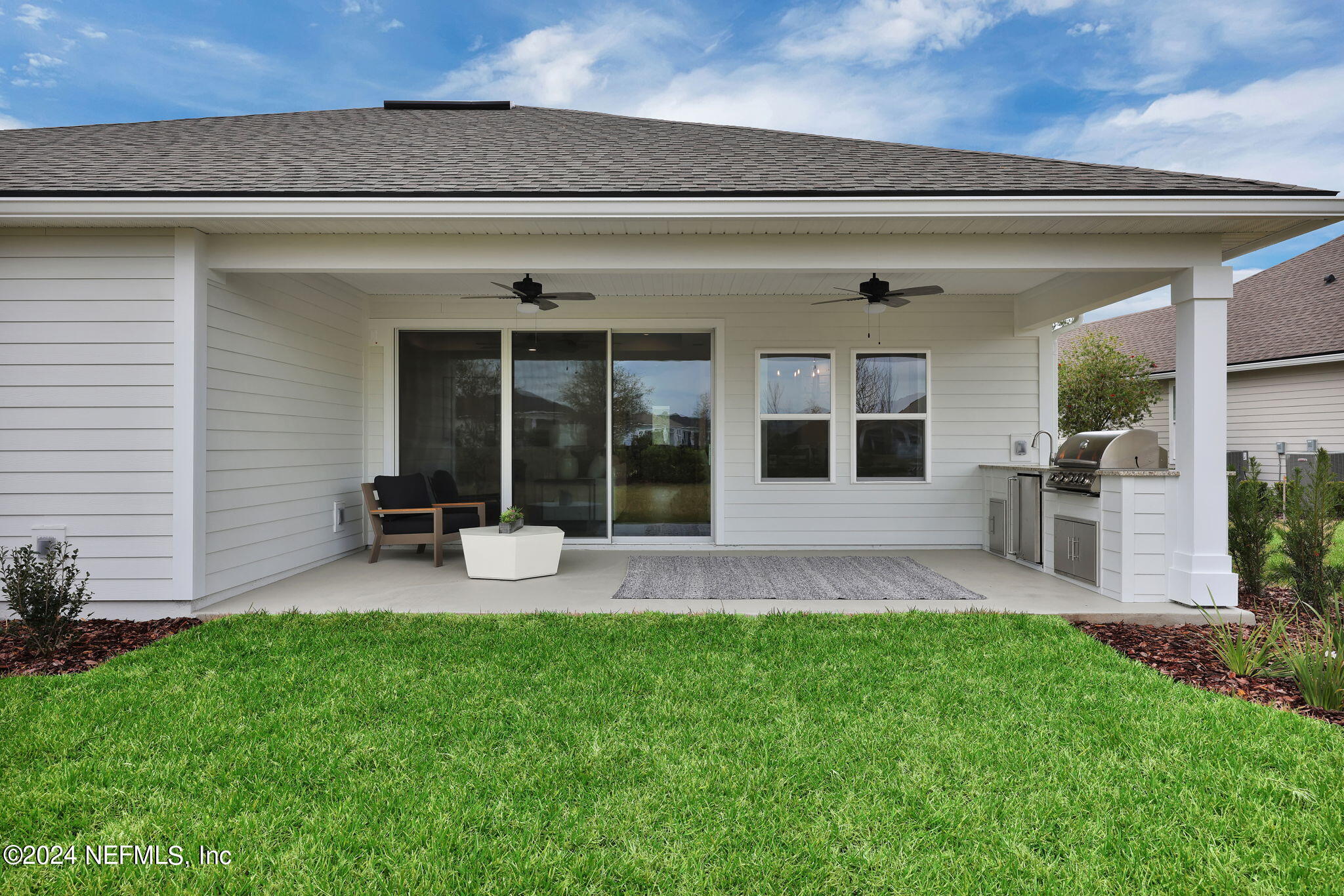 861 Goldenrod Drive St. Augustine, FL 32092 - Photo 7 of 83 a view of a house with backyard and sitting area