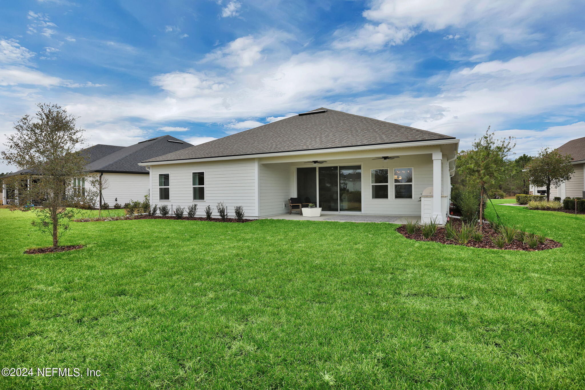 861 Goldenrod Drive St. Augustine, FL 32092 - Photo 8 of 83 a view of an house that has garden
