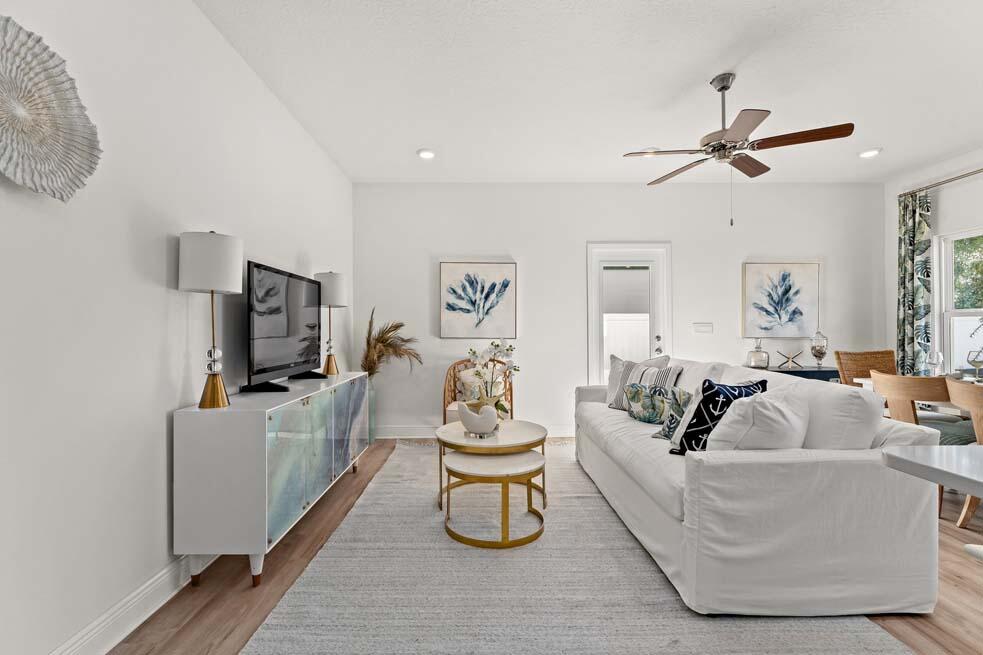 2 Redbird Loop Destin, FL 32541 - Photo 12 of 30 a living room with furniture and a flat screen tv