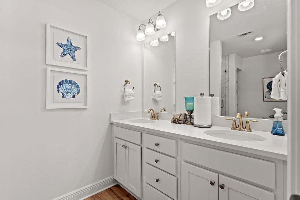2 Redbird Loop Destin, FL 32541 - Photo 13 of 30 a bathroom with a double vanity sink and a mirror