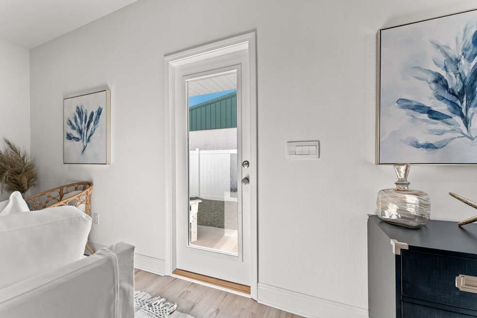 2 Redbird Loop Destin, FL 32541 - Photo 17 of 30 a living room with furniture and a painting on the wall