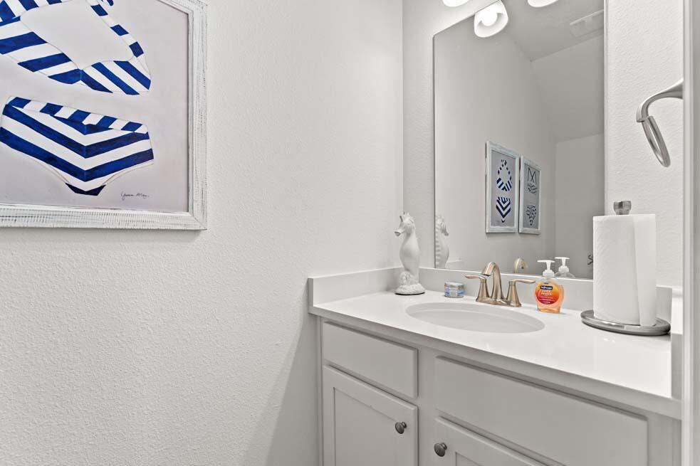 2 Redbird Loop Destin, FL 32541 - Photo 18 of 30 a bathroom with a sink and a mirror