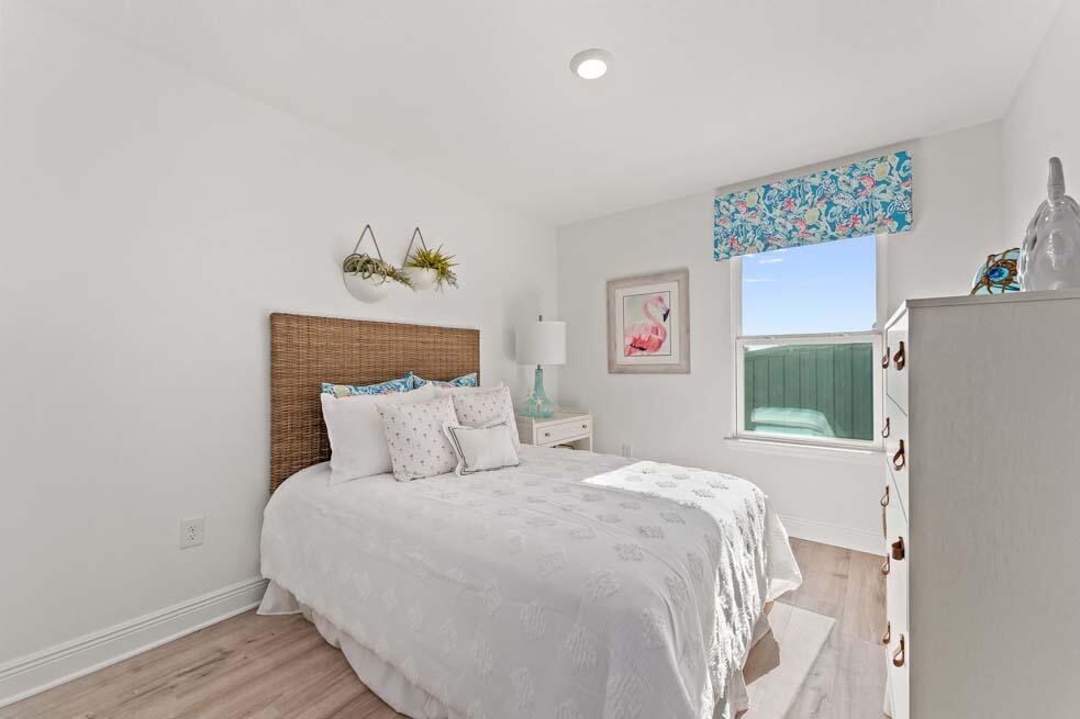 2 Redbird Loop Destin, FL 32541 - Photo 24 of 30 a bedroom with a bed table and a window