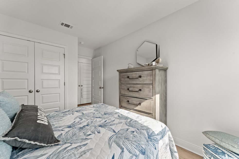 2 Redbird Loop Destin, FL 32541 - Photo 27 of 30 a bedroom with a bed and a dresser