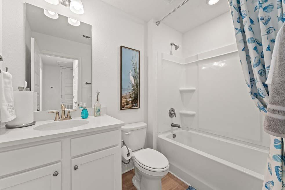 2 Redbird Loop Destin, FL 32541 - Photo 28 of 30 a bathroom with a bathtub shower sink vanity mirror and toilet