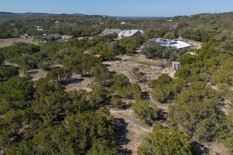 an aerial view of a house with mountain view