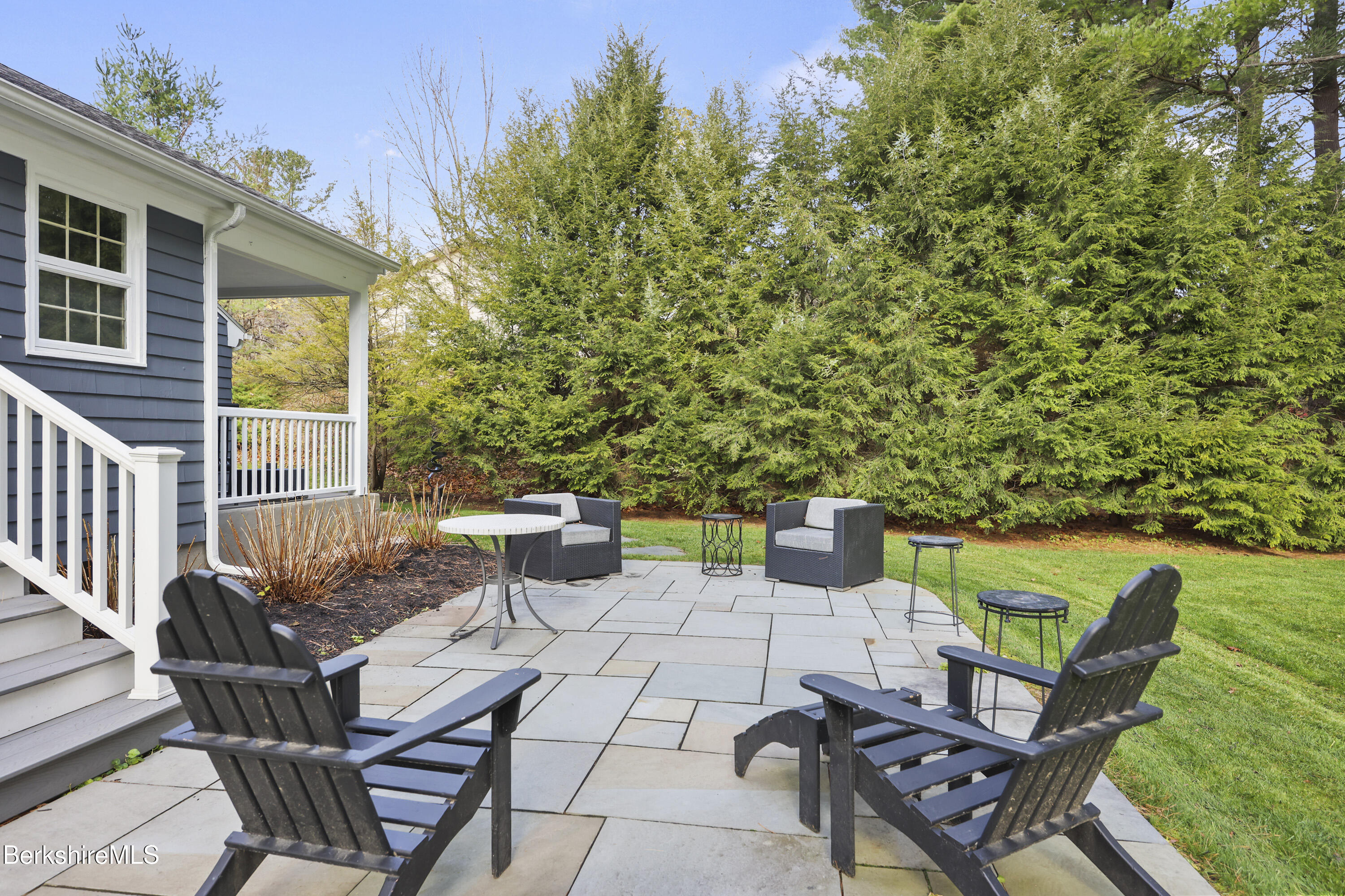 69 Gravesleigh Terrace Pittsfield, MA 01201 - Photo 71 of 84 a view of a patio with table and chairs and potted plants with wooden floor and fence