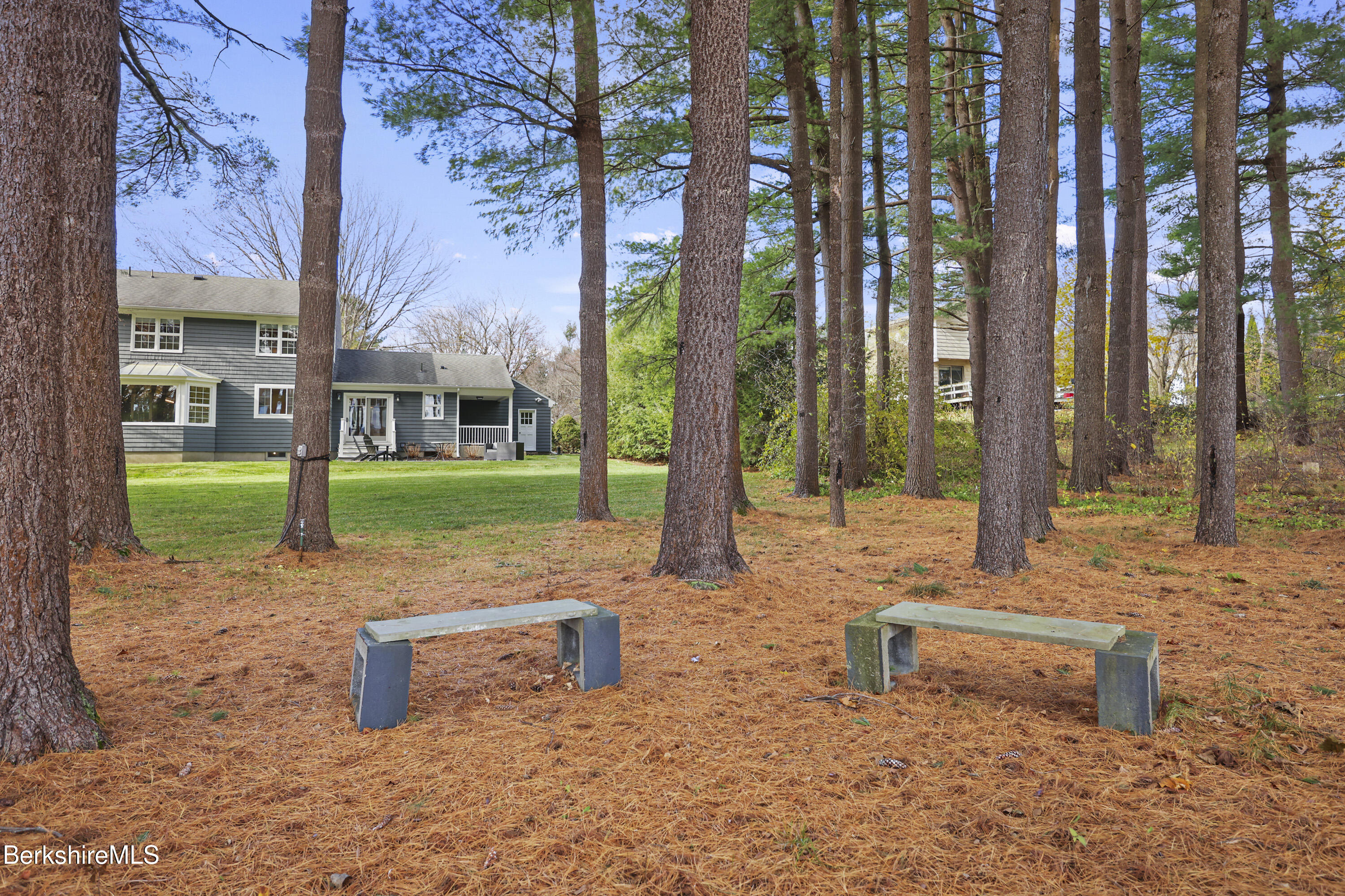 69 Gravesleigh Terrace Pittsfield, MA 01201 - Photo 82 of 84 a view of a garden with a bench