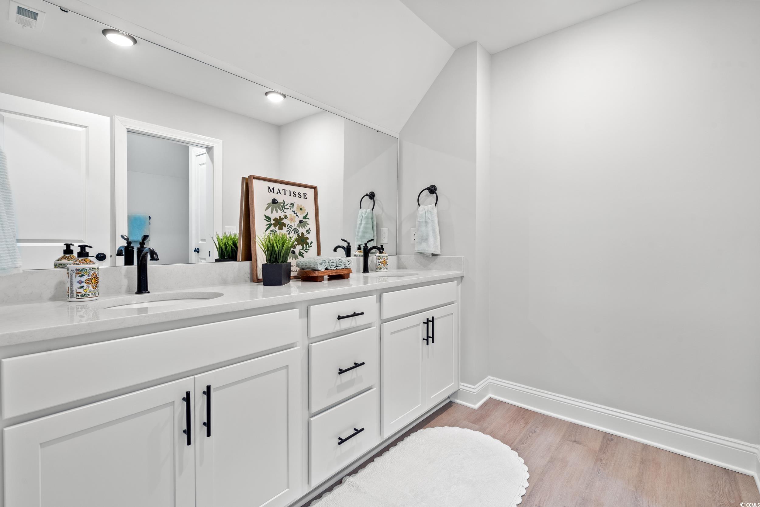 852 Commanders Island Road Georgetown, SC 29440 - Photo 18 of 37 Bathroom with double vanity, wood finished floors, baseboards, and recessed lighting