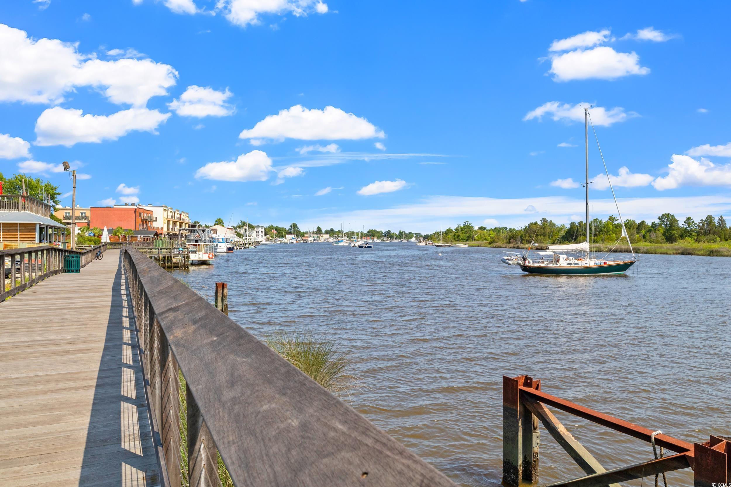 852 Commanders Island Road Georgetown, SC 29440 - Photo 27 of 37 View of dock featuring a water view
