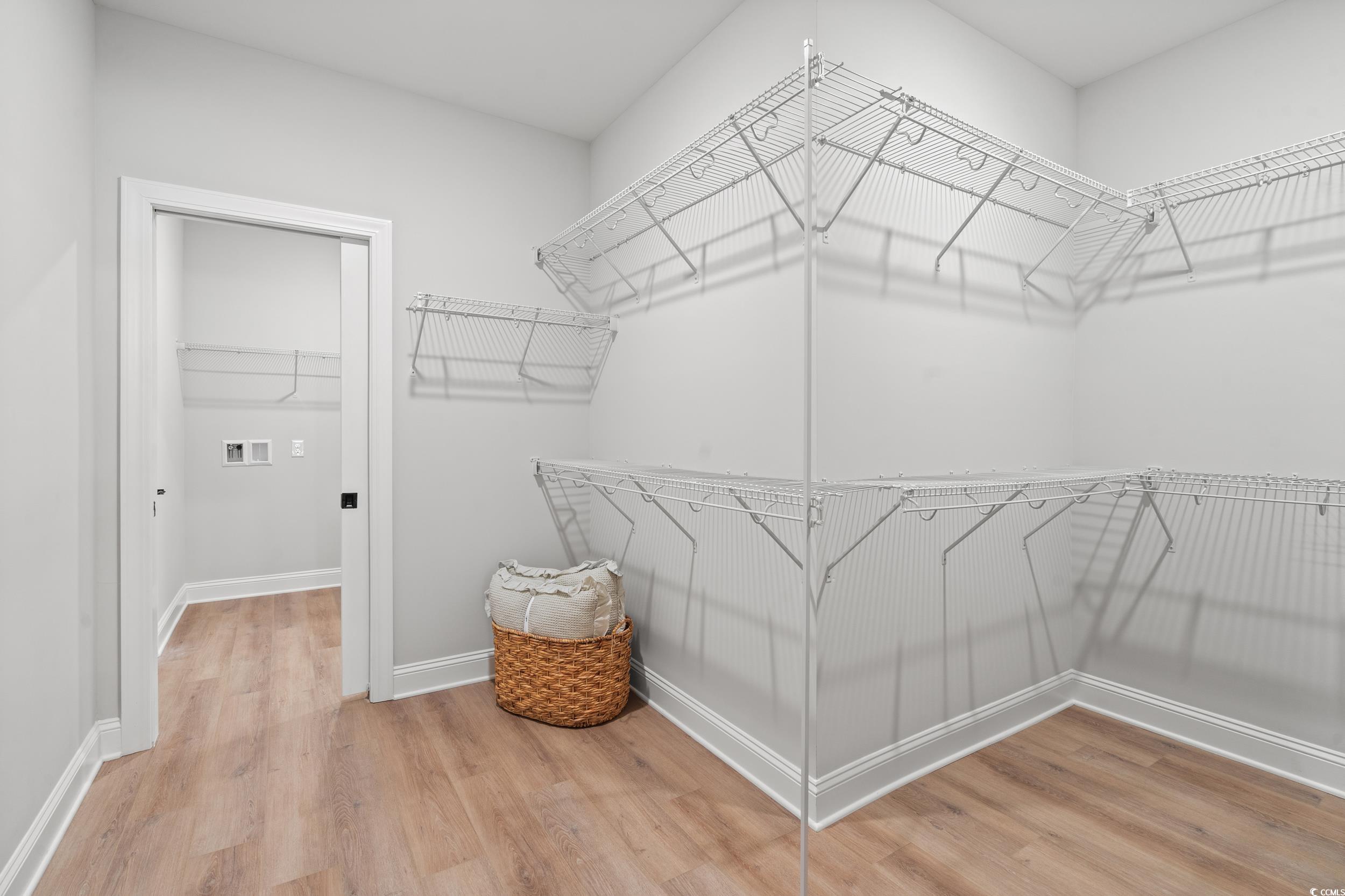 852 Commanders Island Road Georgetown, SC 29440 - Photo 8 of 37 Walk in closet with wood finished floors